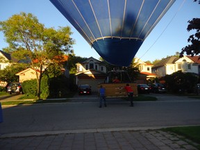 A sudden wind drop forced the pilot of a Sundance Balloons craft to make a rare city landing Saturday. (Carmen McLean photo)