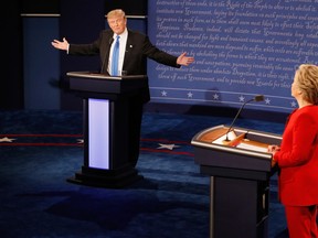Republican presidential nominee Donald Trump (L) speaks as Democratic presidential nominee Hillary Clinton (R) listens during the Presidential Debate at Hofstra University on September 26, 2016 in Hempstead, New York. The first of four debates for the 2016 Election, three Presidential and one Vice Presidential, is moderated by NBC's Lester Holt. (Photo by Pool/Getty Images)