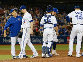 Blue Jays manager John Gibbons takes pitcher J.A. Happ out of the game against the New York Yankees at the Rogers Centre in Toronto on Sept. 26, 2016. (STAN BEHAL/Toronto Sun)