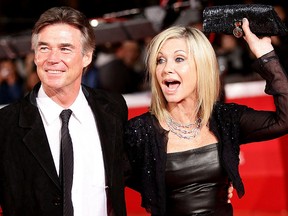 Actress Olivia Newton-John, right, and John Easterling attend the 'A Few Best Man' premiere during the 6th International Rome Film Festival at Auditorium Parco Della Musica on Oct. 28, 2011, in Rome, Italy. (Vittorio Zunino Celotto/Getty Images for Lancia)
