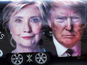 A TV van with pictures of Democratic candidate Hillary Clinton and Republican Donald Trump is seen prior to the first presidential debate at Hofstra University's David & Mack Sport and Exhibition Complex in Hempsted, N.Y., on Sept. 26, 2016. (JEWEL SAMAD/AFP/Getty Images)