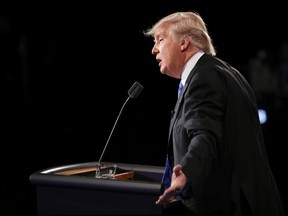 Republican presidential nominee Donald Trump looks toward Democratic presidential nominee Hillary Clinton as he answers a question during the presidential debate at Hofstra University in Hempstead, N.Y., Monday, Sept. 26, 2016. (Joe Raedle/Pool via AP)