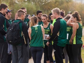 Members of the Lakeland College Rustlers' Cross Country team meet in a huddle before the women's five kilometre race on Saturday, Sept. 24, in the Vermilion Provincial Park. Taylor Hermiston/Vermilion Standard /Postmedia Network.