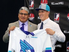 Kyle Jackson, right, holds up a Rochester Knighthawks jersey along with team owner and general manager Curt Styres during the National Lacrosse League draft at the Toronto Rock Athletic Centre on Monday, Sept. 26, 2016 in Oakville, Ont. Jackson was drafted seventh overall by Rochester. (Handout)