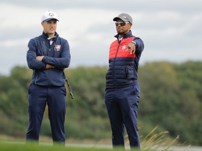 United States vice-captain Tiger Woods talks to Jordan Spieth on the seventh hole during a practice round for the Ryder Cup golf tournament Sept. 27, 2016, at Hazeltine National Golf Club in Chaska, Minn. (AP Photo/Charlie Riedel)