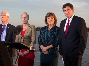 Jim Carr, Minister of Natural Resources, from left to right, Catherine McKenna, Minister of Environment and Climate Change, British Columbia Premier Christy Clark and Dominic LeBlanc, Minister of Fisheries, Oceans and the Canadian Coast Guard, listen to a question after the federal government announced approval of the Pacific NorthWest LNG project, at the Sea Island Coast Guard Base, in Richmond, B.C., on Tuesday September 27, 2016. (THE CANADIAN PRESS/Darryl Dyck)