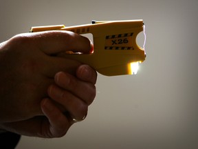 A representative from Taser International fires the company's X26 stun gun during the Police Federation Conference at Winter Gardens on May 16, 2007 in Blackpool, England. (Christopher Furlong/Getty Images)