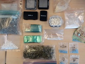 Drugs and cash seized by police following the execution of a search warrant in Kingston, Ont. on Friday, September 23. 2016. Photo supplied by Kingston Police