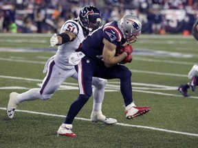 Houston Texans linebacker John Simon chases down New England Patriots wide receiver Julian Edelman (11) during the first half of an NFL football game Thursday, Sept. 22, 2016, in Foxborough, Mass. (AP Photo/Charles Krupa)