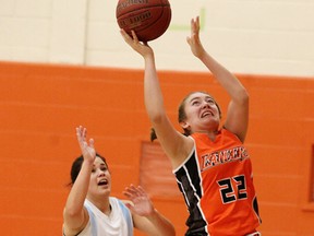 St. Benedict Bears' Isabella Borello tries to block a shot by Ellie McIntyre of the Lasalle Lancers during senior girls basketball action in Sudbury on Monday. Gino Donato/Sudbury Star