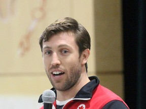 Canadian Olympian Dylan Moscovitch speaks to students at Holy Trinity Catholic School on Wednesday September 28, 2016 in Sarnia, Ont. The 32-year-old Toronto native won silver in the team event at the 2014 Sochi Games along with former partner Kirsten Moore-Towers. (Terry Bridge/Sarnia Observer)