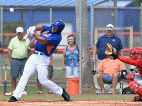 Tim Tebow hits solo home run in his first at bat during the first inning of his first instructional league baseball game for the New York Mets against the St. Louis Cardinals instructional club Wednesday, Sept. 28, 2016, in Port St. Lucie, Fla. (Jeremiah Wilson/The Stuart News via AP)