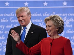 Republican nominee Donald Trump (L) and Democratic nominee Hillary Clinton arrive for the first presidential debate at Hofstra University in Hempstead, New York on September 26, 2016. (Jewel SAMADJEWEL SAMAD/AFP/Getty Images)
