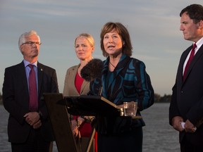 British Columbia Premier Christy Clark, third left, speaks as Jim Carr, from left to right, Minister of Natural Resources, Catherine McKenna, Minister of Environment and Climate Change, and Dominic LeBlanc, Minister of Fisheries, Oceans and the Canadian Coast Guard, listen after the federal government announced approval of the Pacific NorthWest LNG project, at the Sea Island Coast Guard Base, in Richmond, B.C., on Tuesday September 27, 2016. (THE CANADIAN PRESS/Darryl Dyck)