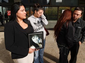 Family of Faith Jackson are seen as her mother Rebecca Benjamin (second from right) speaks outside of Court of Queen's Bench after the sentencing of Ken Didechko in the hit and run death of her daughter Faith in Edmonton, Alberta on Wednesday, September 28, 2016. Ian Kucerak / Postmedia