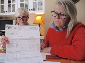 Niagara Falls residents Laura Birrell (left) and Fran McLaughlin, who have seen their hydro bill triple during the past couple of years, are seen at their home Wednesday, Sept. 28, 2016. (Ray Spiteri/Postmedia Network)
