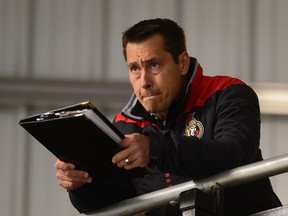 Ottawa Senators head coach Guy Boucher watches his team during Day 2 of training camp in Ottawa on Sept. 23, 2016. (THE CANADIAN PRESS/Sean Kilpatrick)