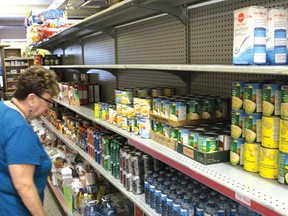Joan Clarkson, coordinator at the Helping Hand Food Bank in Tillsonburg, checks the shelves earlier this month. On Saturday, Oct. 1, the food bank is asking the residents of Tillsonburg to support their one-day Fall Food Blitz by leaving food items on their front steps (clearly visible) to be picked up by volunteers between 10-11 a.m.