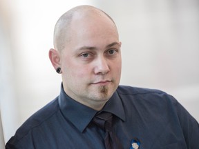 Ryan Colton was honoured with an Edmonton Police Commission Citizen Award for his role in helping police during a shooting that killed EPS Const. Daniel Woodall. Shaughn Butts / Postmedia