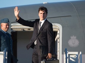 Prime Minister Justin Trudeau boards a government plane in Ottawa, Thursday September 29, 2016. Trudeau is heading to Israel for the funeral of former President of Israel, Shimon Peres, who died at the age of 93. (THE CANADIAN PRESS/Adrian Wyld)