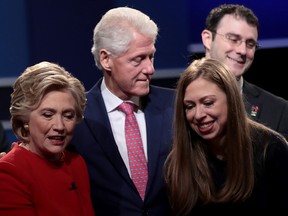 Left to right: Democratic presidential nominee Hillary Clinton looks on with husband and former U.S. President Bill Clinton and daughter, Chelsea Clinton after the Presidential Debate with Republican presidential nominee Donald Trump at Hofstra University on September 26, 2016 in Hempstead, New York. (Photo by Drew Angerer/Getty Images)