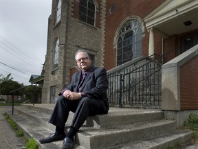 Rev. Richard Golden sits on the front steps of the former Hyatt Avenue United Church on Hamilton Road in London, Ont. on Thursday September 29, 2016. The church, which was closed and sold due to dwindling attendance, has been purchased by an Egyptian community group who will be reopening the building as a mosque. Craig Glover/The London Free Press/Postmedia Network  
Craig Glover