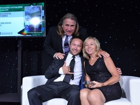 Fourteen Estates accepts award for most outstanding custom home at the OHBA’s Awards of Distinction held in Collingwood on Tuesday Sept. 20. The company is family owned and the three family members came up together to accept the award, from left: Rick, Shawn and Karen Rondeau.