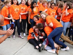 Tim Miller/The Intelligencer
Matt Sager, education counsellor at Moira Secondary School, takes a photo of a group of students gathered in front of the school for Orange Shirt Day on Thursday in Belleville. The shirts were worn as a show of support for Aboriginal children forced to attend the Indian Residential School System.