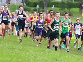 Participants get started in the Senior Girls and Midget Boys 5500m at the  Laurentian University trails during the Laurentian University "Rumble on the Rock" High School XC Race in Sudbury, Ont. on Tuesday September 27, 2016. For race results go to the Track North Athletic Club website.Gino Donato/Sudbury Star/Postmedia Network