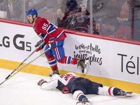 Montreal Canadiens' Andrew Shaw skates away after checking Washington Capitals' Connor Hobbs into the boards during second period NHL pre-season hockey action Tuesday, September 27, 2016 in Montreal. (THE CANADIAN PRESS/Ryan Remiorz)