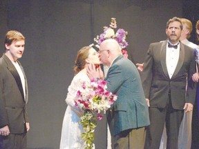 Rita, played by Charlotte Weeks, smooches Old Man, Alan Legg, as Dr. Boyle, played by Colin Foster, reacts, in the London Community Players? production of Prelude to a Kiss, opening Friday on the main stage at the Palace Theatre. (Ross Davidson, Special to Postmedia News)