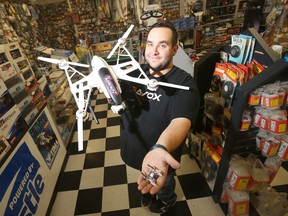 Ryan Gobeil displays remotely controlled drones at Eliminator RC. (Chris Procaylo/Winnipeg Sun)