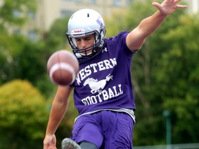 Western Mustang kicker Marc Liegghio practices in the end zone at TD stadium (MIKE HENSEN, The London Free Press)