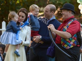 Prince William, and his wife Kate, the Duke and Duchess of Cambridge, take part in a tea party with their children, Prince George and Princess Charlotte, at Government House in Victoria, Thursday, Sept. 29, 2016. (THE CANADIAN PRESS/Jonathan Hayward)