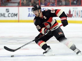 Ottawa Senators' Erik Karlsson skates with the puck during second period NHL hockey action against the Colorado Avalanche in Ottawa on Feb. 11, 2016. (THE CANADIAN PRESS/Sean Kilpatrick)