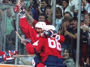 Wayne Gretzky and Mario Lemieux celebrate Lemieux's winning goal in Canada Cup game against the Soviet Union in September 1987. (THE CANADIAN PRESS/Scott Macdonald)