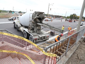 Jason Miller/The Intelligencer
Crews work to meet the November completion date for the CP overpass and Dundas Street West rehabilitation project, pictured here.