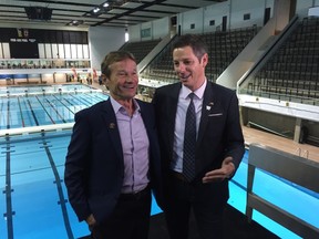 Mayor Brian Bowman (right) with 2017 Canada Summer Games co-chair Hubert Mesman at Winnipeg's Pan Am Pool on Friday. The pool is reopening after millions in renovations and upgrades in advance of next year's Games. (DAVID LARKINS/WINNIPEG SUN)