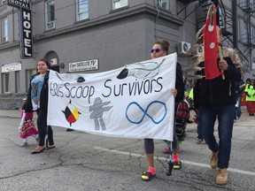 A rally for awareness of the '60s Scoop marched towards the Legislature on Friday. (DAVID LARKINS/WINNIPEG SUN)