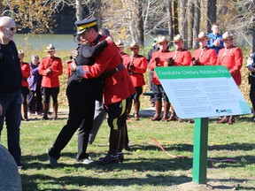 Shelley West, mother of Const. Chelsea Robinson, embraces Marlin Degrand, RCMP assistant commissioner, during the official opening of Constable Chelsea Robinson Park on Sept. 24. The park located along the North Saskatchewan River and Range Road 23 was named in honour of the fallen RCMP constable from Stony Plain Detachment, who was killed in the line of duty in a traffic collision in 2010 - Photo by Crystal St.Pierre