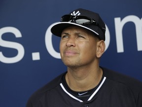 New York Yankees' Alex Rodriguez sits in the dugout during a spring training baseball workout in Tampa, Fla. (AP Photo/Lynne Sladky, File)