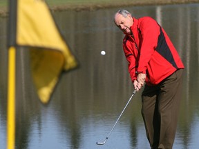 Northern Bear Pro Bill Penny demonstrates the way to make a chip shot in this 2007 file photo.