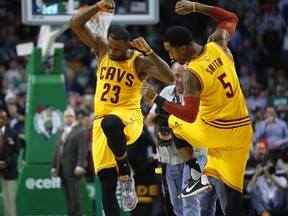 Cleveland Cavaliers' LeBron James and J.R. Smith dance before an NBA basketball game against the Boston Celtics in Boston. (AP Photo/Winslow Townson)