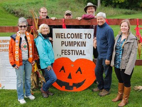 Donna Wood, Judy Ward, Ben Freemna, Alvin Wood, Doug Angle, Brian Ward, Amanda Pantrey, members of the Battersea Pumpkin Festival organizing committee take a quick break to pose for a photo before getting back to work in Battersea, Ont. on Thursday September 29, 2016. The 22nd annual festival starts Saturday, Oct 1 morning and includes a parade, corn maze, haunted barn, live music, treats and more. Julia McKay/The Whig-Standard/Postmedia Network