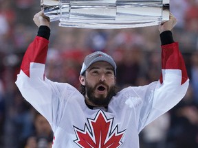 Drew Doughty with the championship trophy after beating Team Europe at the World Cup of Hockey in Toronto on Sept. 29, 2016. (Craig Robertson/Toronto Sun/Postmedia Network)