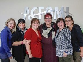 Diane Sabourin, Run for the Cure - Kingston volunteer run director, centre with glasses, poses for a photo with her co-workers in Kingston, Ont. on Thursday September 29, 2016. The women are supporting Sabourin by participating in run this Sunday at St. Lawrence College. Julia McKay/The Whig-Standard