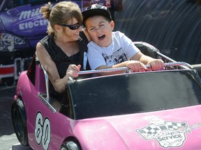 Tammy Campbell and her grandson Aiden Campbell, 7, of London, at the Western Fair's Day of Dreams Sept. 14. With the fair closed to the public,the midway was opened to special-needs kids who otherwise would have problems dealing with the crowds. Reviews on this year?s fair have been mixed, with one letter writer suggesting changes need to be made to halt a slide into oblivion. (MORRIS LAMONT, The London Free Press)