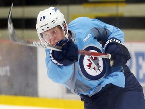 Winnipeg Jets forward Patrik Laine fires a shot on net during NHL hockey practice in Winnipeg, Man. Monday September 26, 2016.