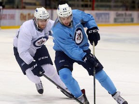 Jimmy Lodge, left, was one of 17 players reassigned by the Winnipeg Jets on Saturday.