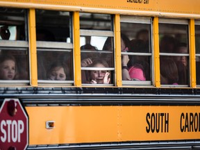 Townville Elementary students look out of the window of a school bus as they are transported to Oakdale Baptist Church, following a shooting at their school in Townville, S.C., on Wednesday, Sept. 28, 2016. (Katie McLean/The Independent-Mail via AP)